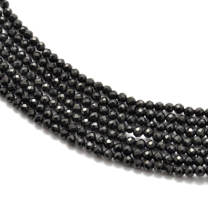 Natural black spinel round faceted beads strand - front view jet black