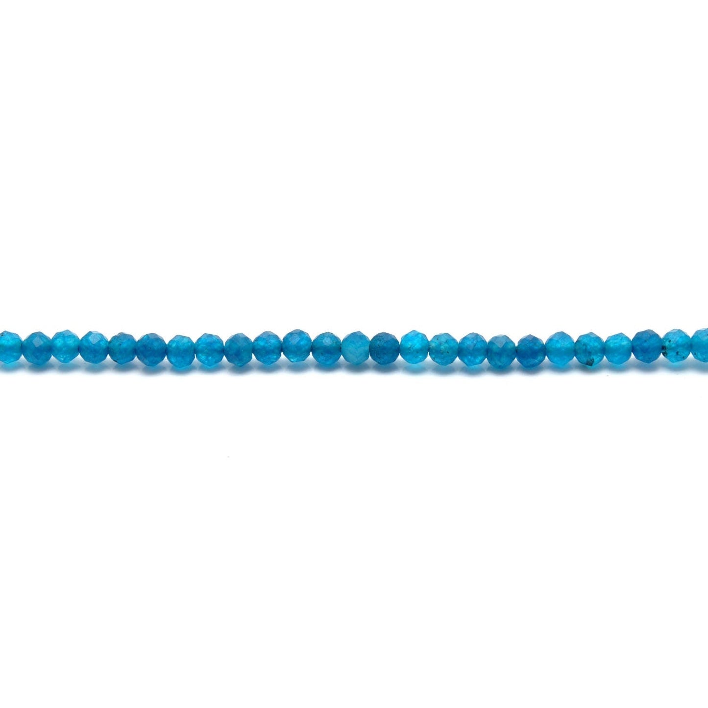 Natural blue apatite beads scattered loose - vivid teal range