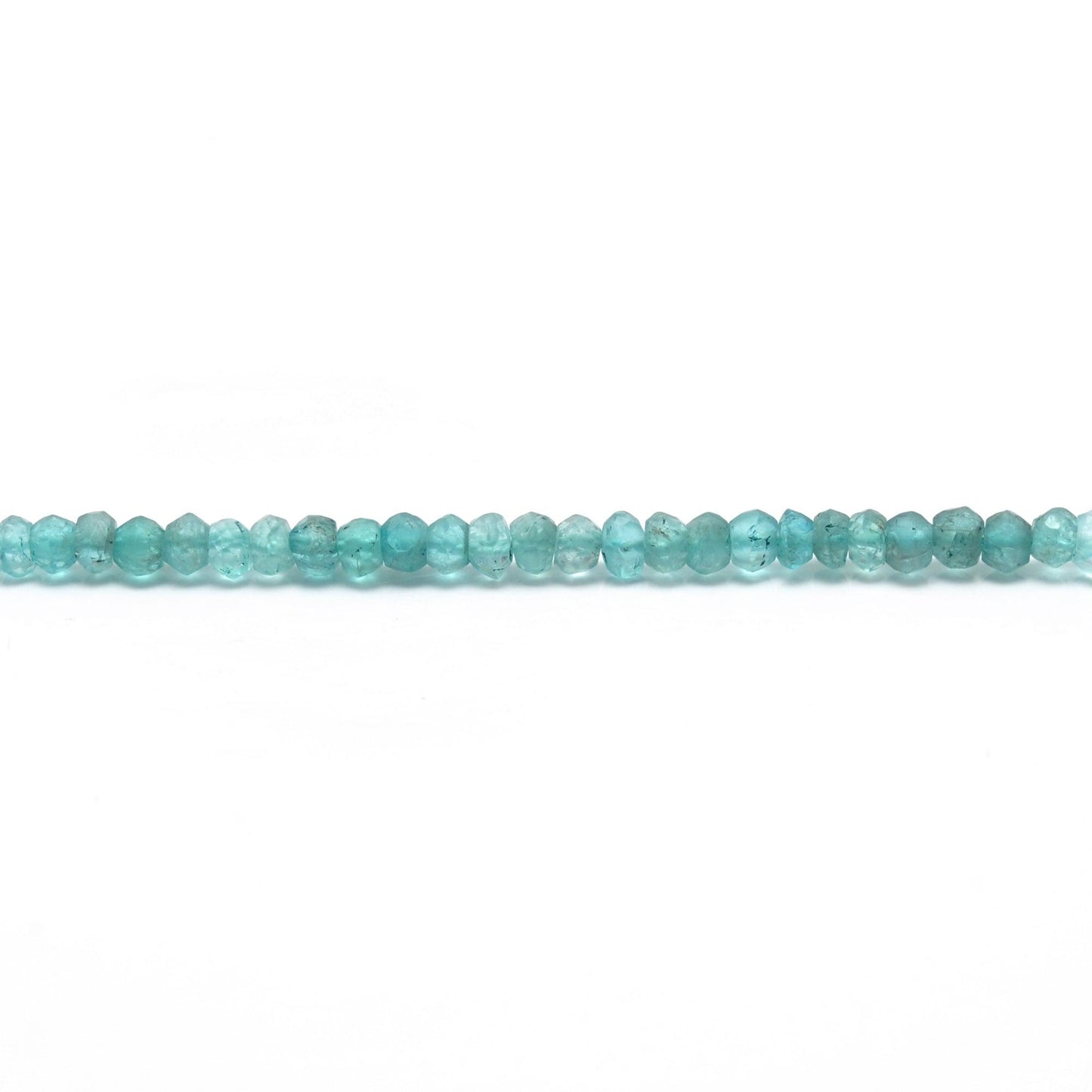 Natural blue apatite rondelle beads scattered loose - teal view