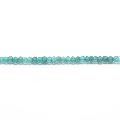 Natural blue apatite rondelle beads scattered loose - teal view