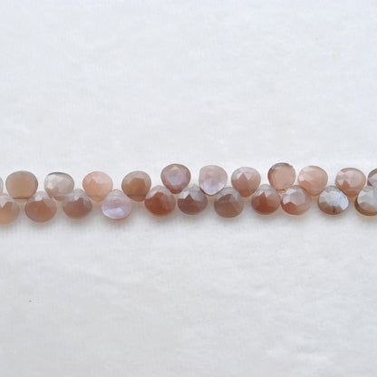 Natural chocolate moonstone heart beads - overhead flat lay warm