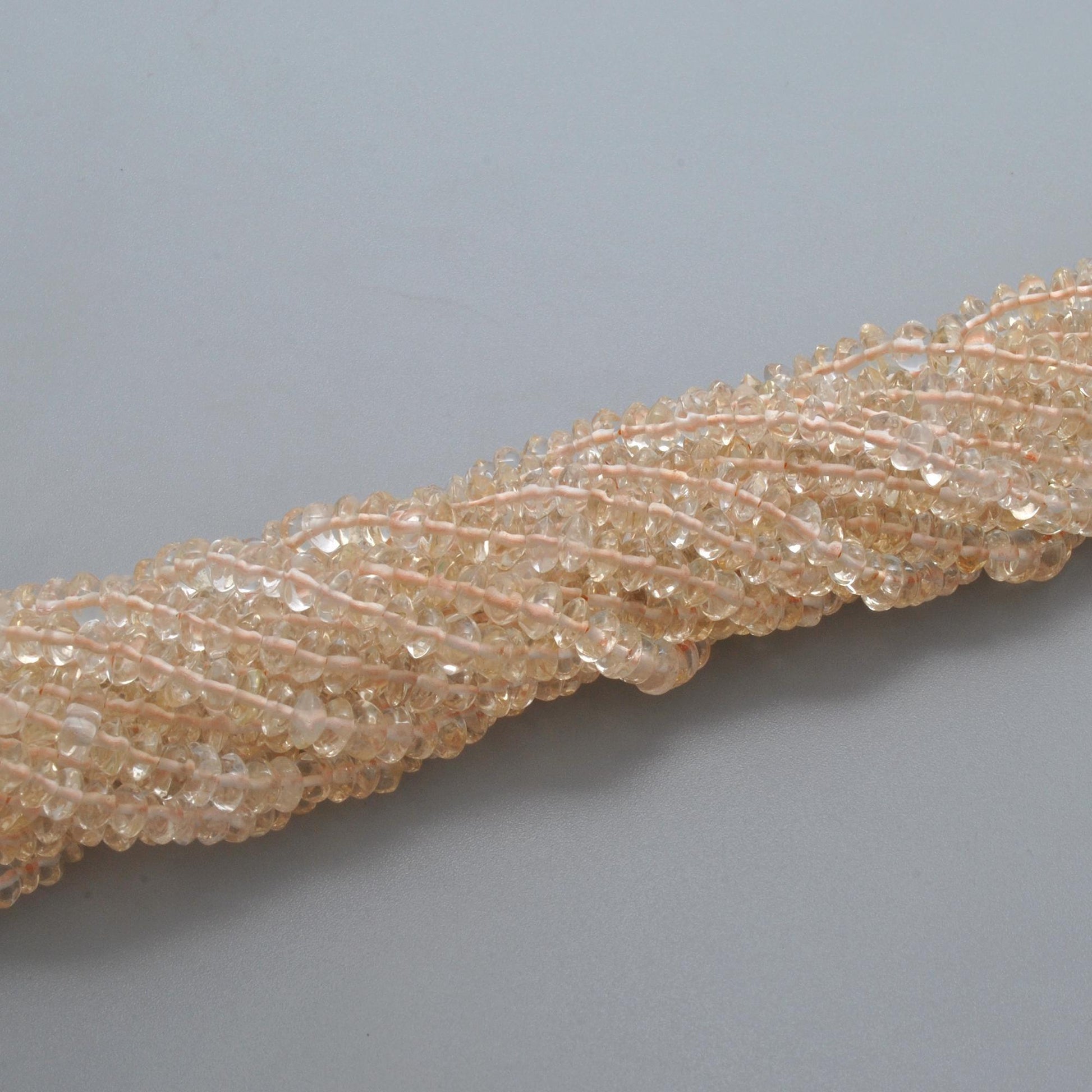 Natural citrine button beads 14 inch strand - overhead flat lay