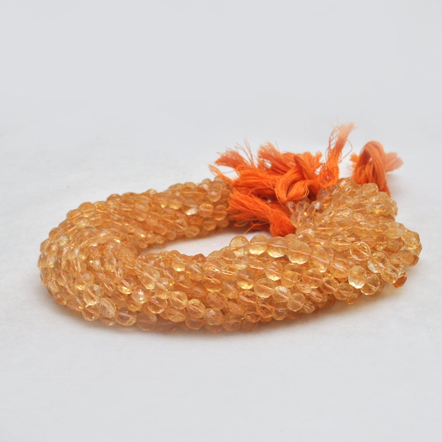 Natural citrine coin beads 14 inch - overhead flat lay warm gold