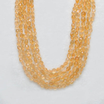 Natural citrine coin beads November birthstone - scale reference