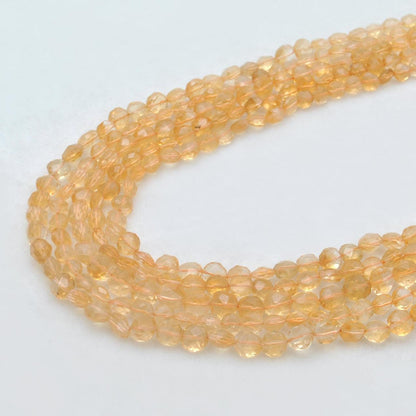 Natural citrine faceted coin beads 14 inch strand - front view golden