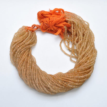 Natural citrine faceted rondelle beads - overhead flat lay strand