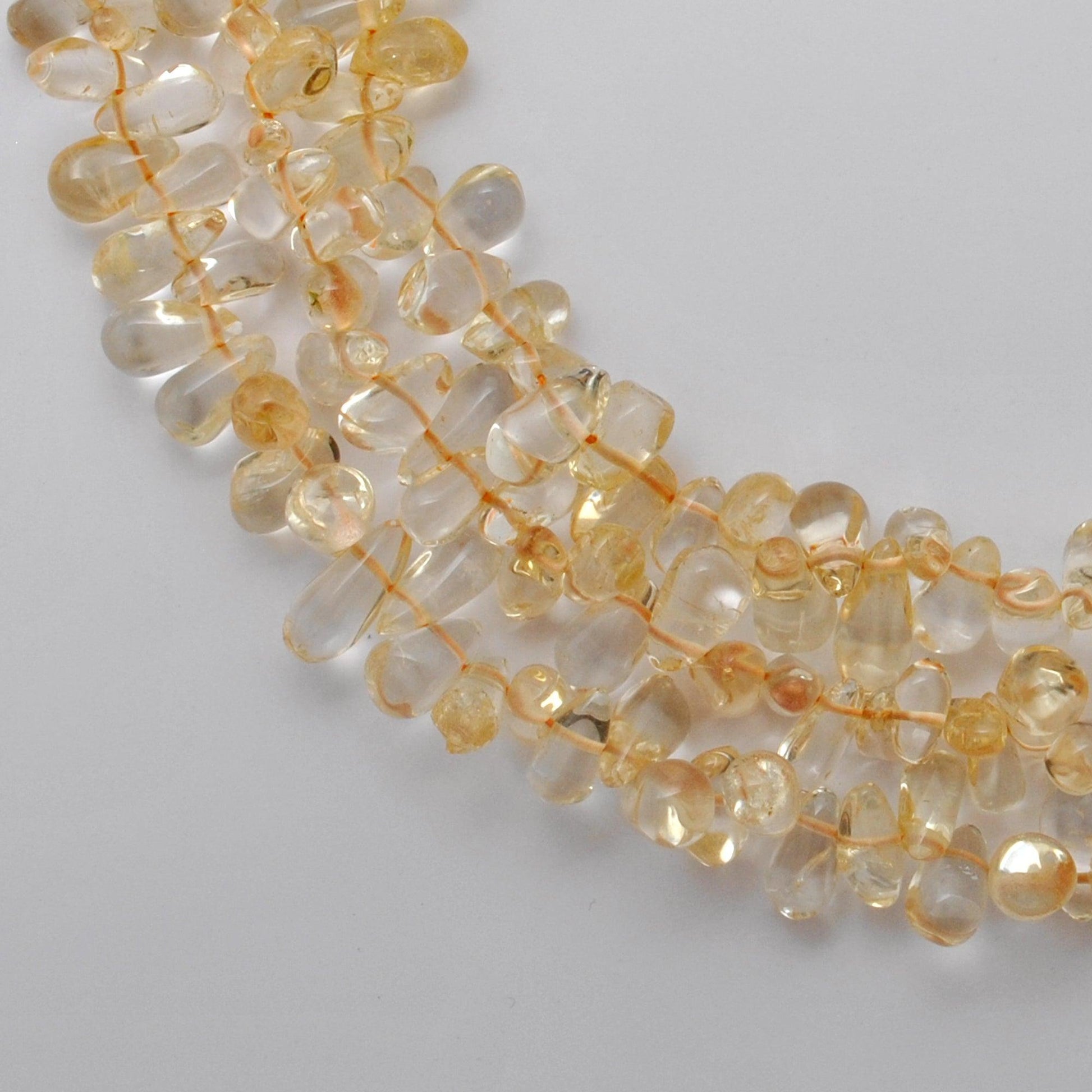Natural citrine plain teardrop beads 16 inch strand - front view golden