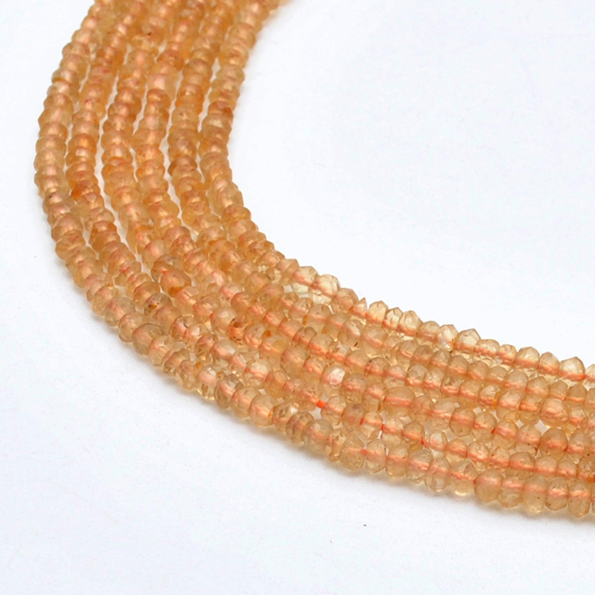 Natural citrine rondelle faceted beads 3-3.5mm - front view golden strand