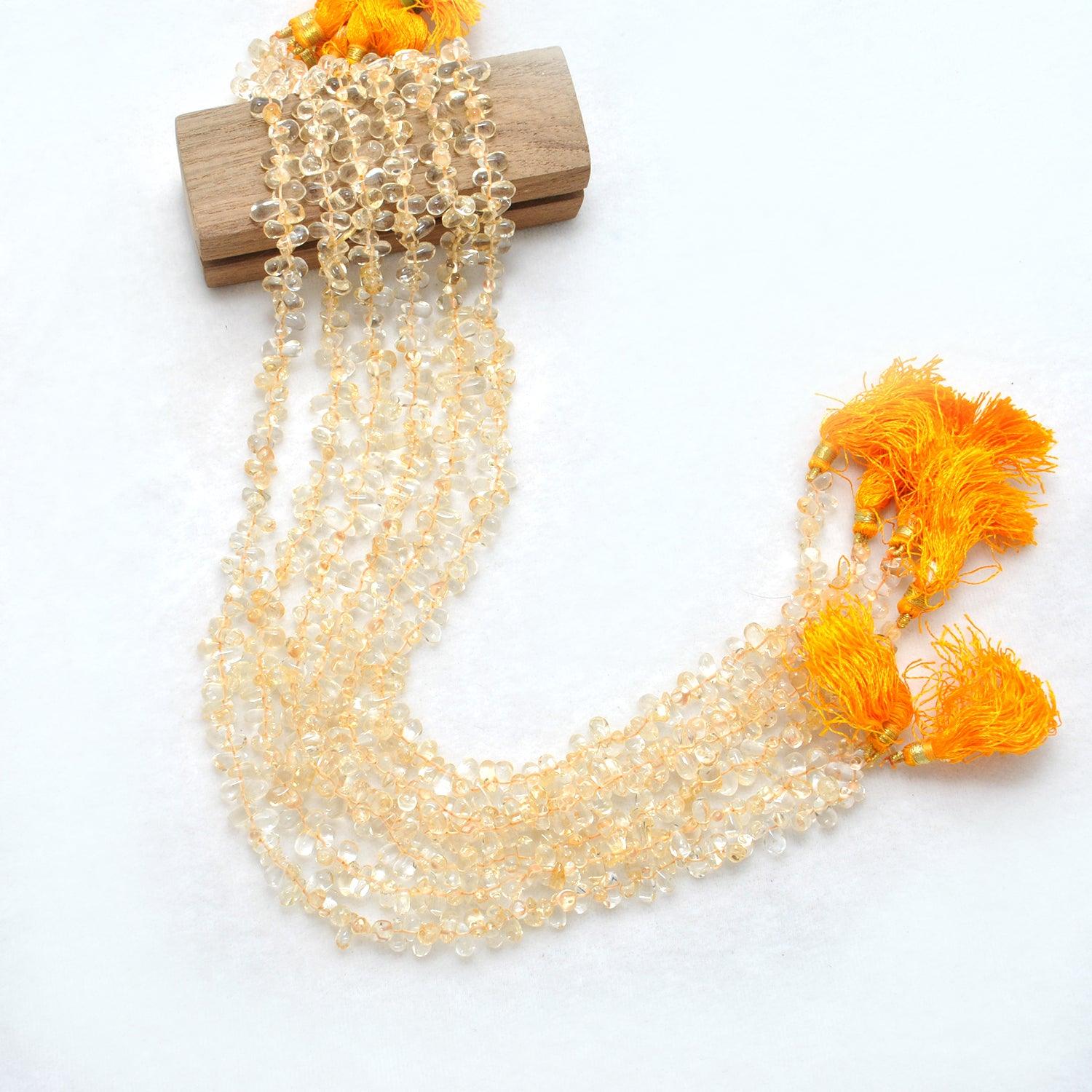 Natural citrine teardrop beads November birthstone - scale