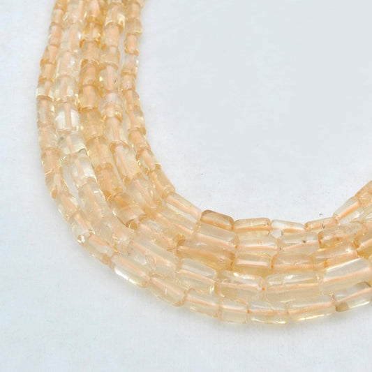 Natural citrine tube beads 16 inch strand - front view golden elongated