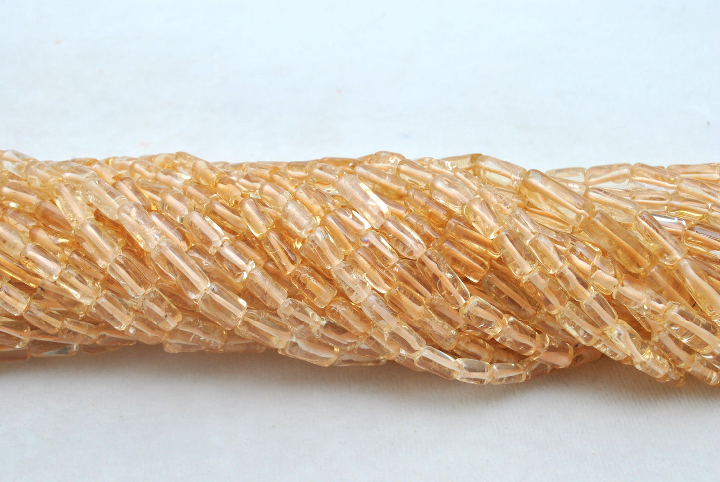 Natural citrine tube beads November birthstone - scale reference