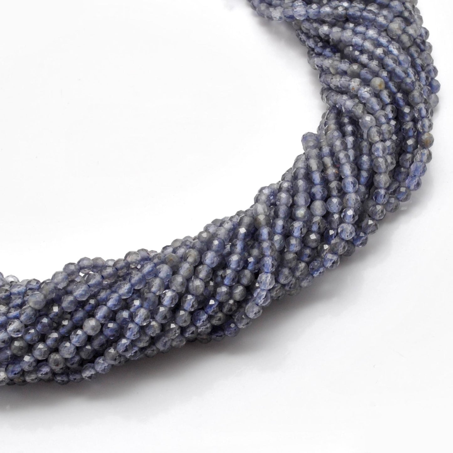 Natural iolite round beads strand - overhead flat lay rare gemstone