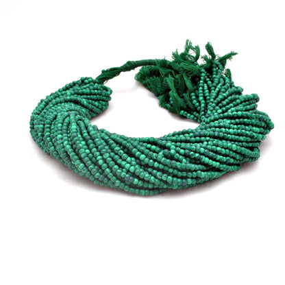 Natural malachite beads strand - overhead flat lay green pattern