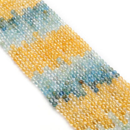 Natural multi aquamarine 4mm beads - overhead flat lay strand