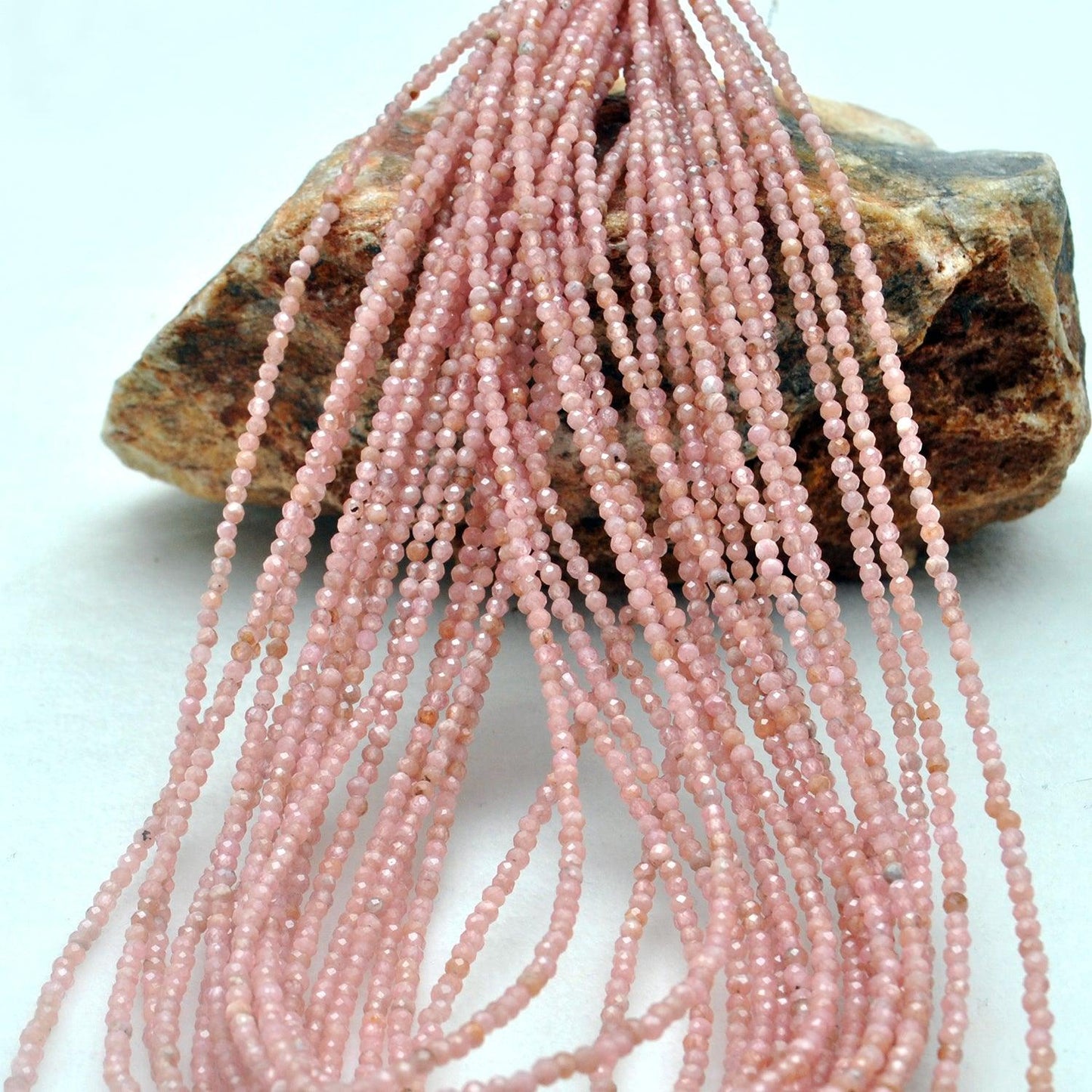Natural peach moonstone beads scattered loose - warm peachy range