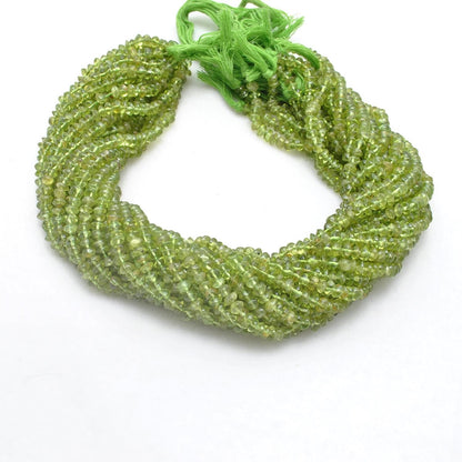 Natural peridot button beads scattered loose - lime olive range