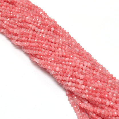 Pink quartz 3-4mm faceted round beads overhead flat lay