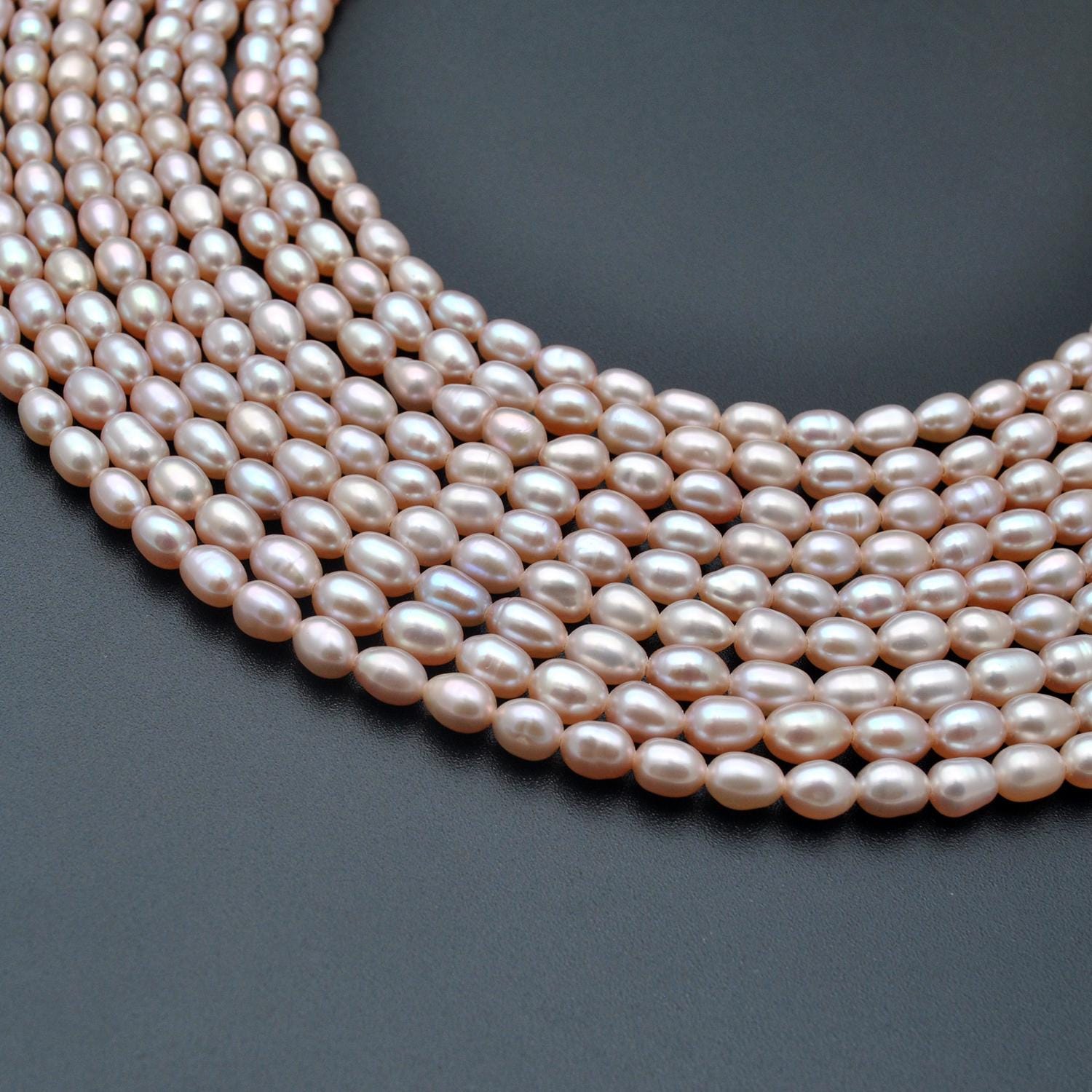 Natural pink rice pearl oval beads 15.5 inch strand - front view