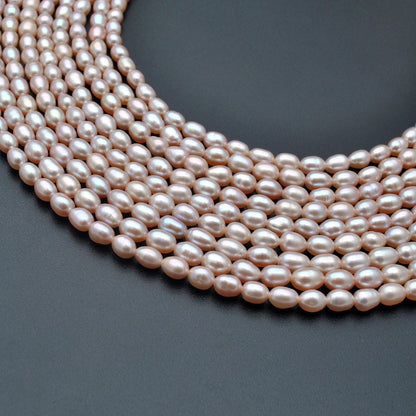 Natural pink rice pearl oval beads 15.5 inch strand - front view