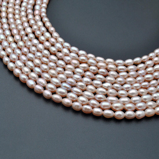 Natural pink rice pearl oval beads 15.5 inch strand - front view