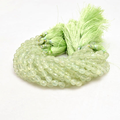 Natural prehnite teardrop beads 10 inch - overhead flat lay pale