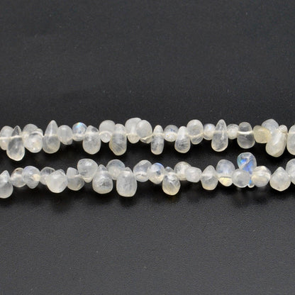 Rainbow moonstone plain drop beads 16 inch strand overhead flat lay