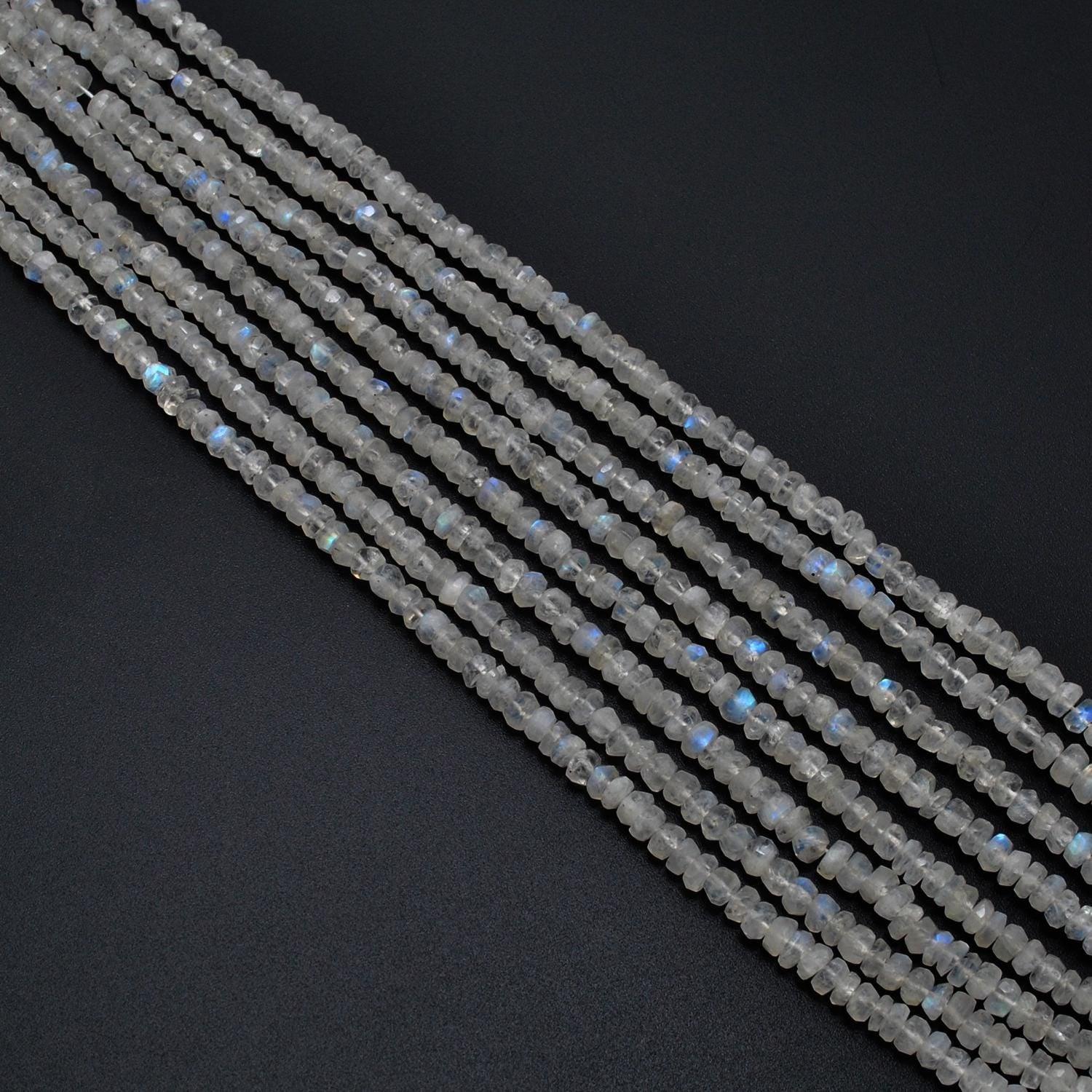 Natural rainbow moonstone rondelle scattered loose - blue flash view