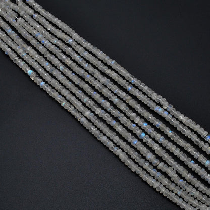 Natural rainbow moonstone rondelle scattered loose - blue flash view