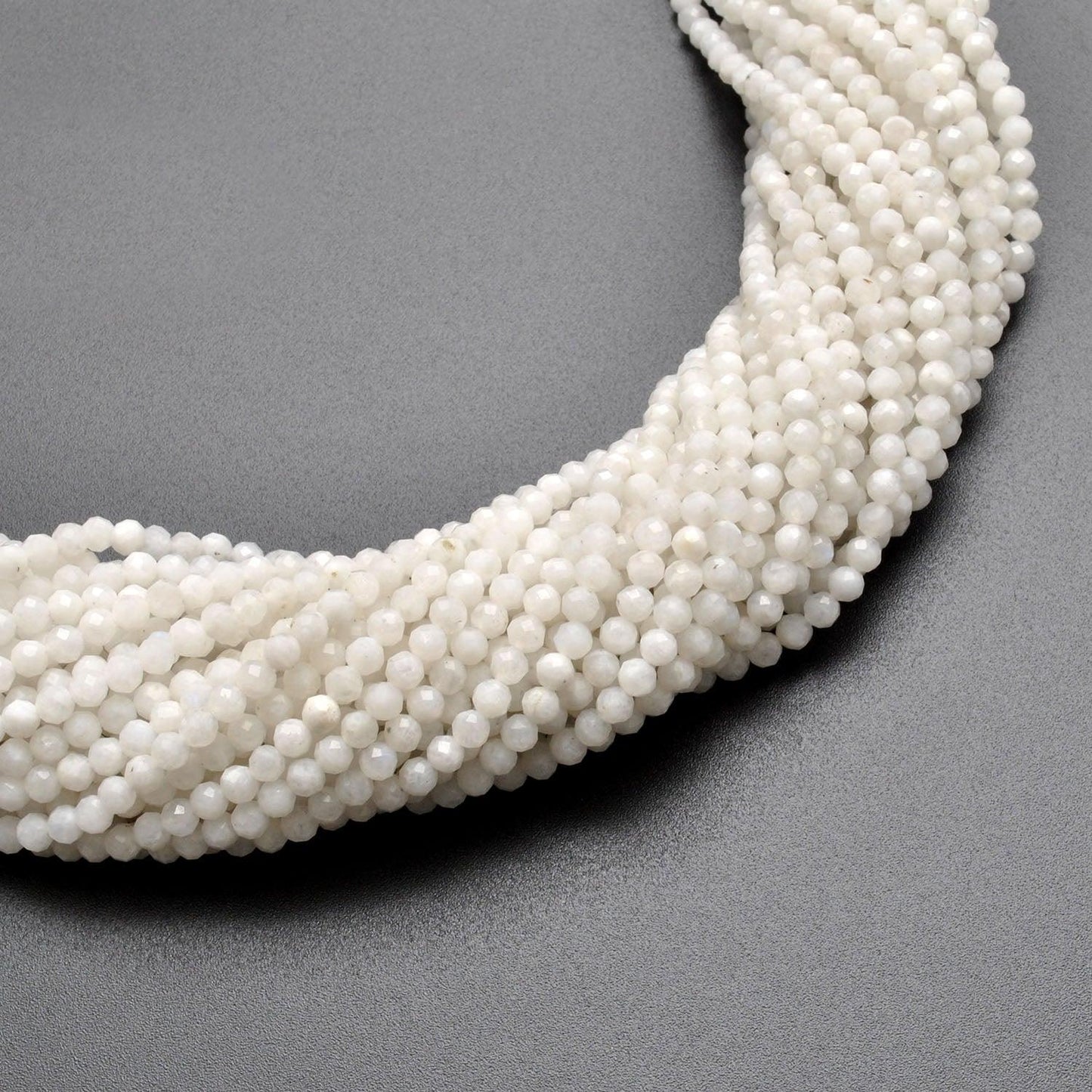 Natural rainbow moonstone round beads 13 inch - overhead flat lay