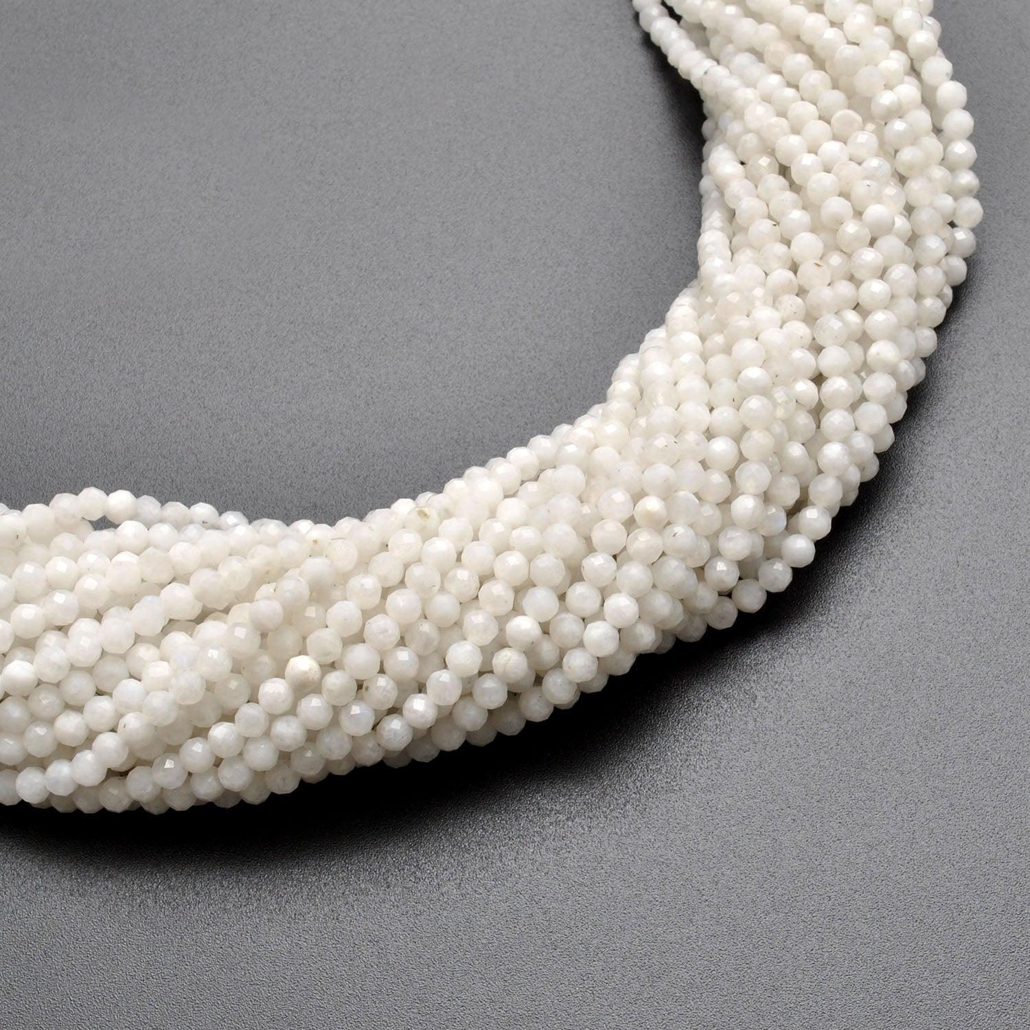Natural rainbow moonstone round beads 13 inch - overhead flat lay