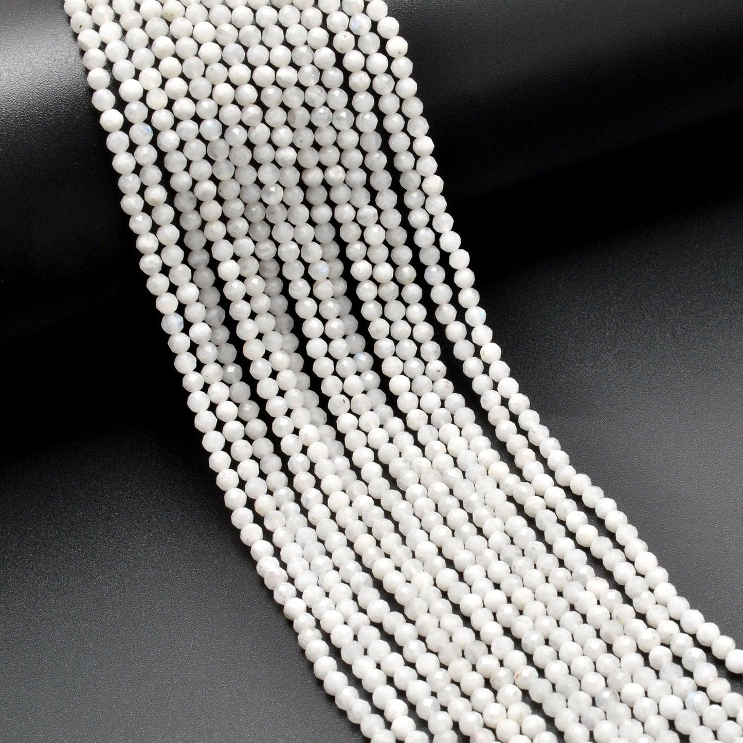 Natural rainbow moonstone round faceted wholesale strand - Jaipur