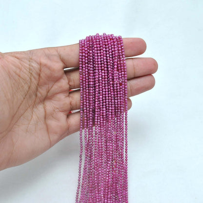 Red moonstone round faceted beads 12.5 inch strand overhead flat lay