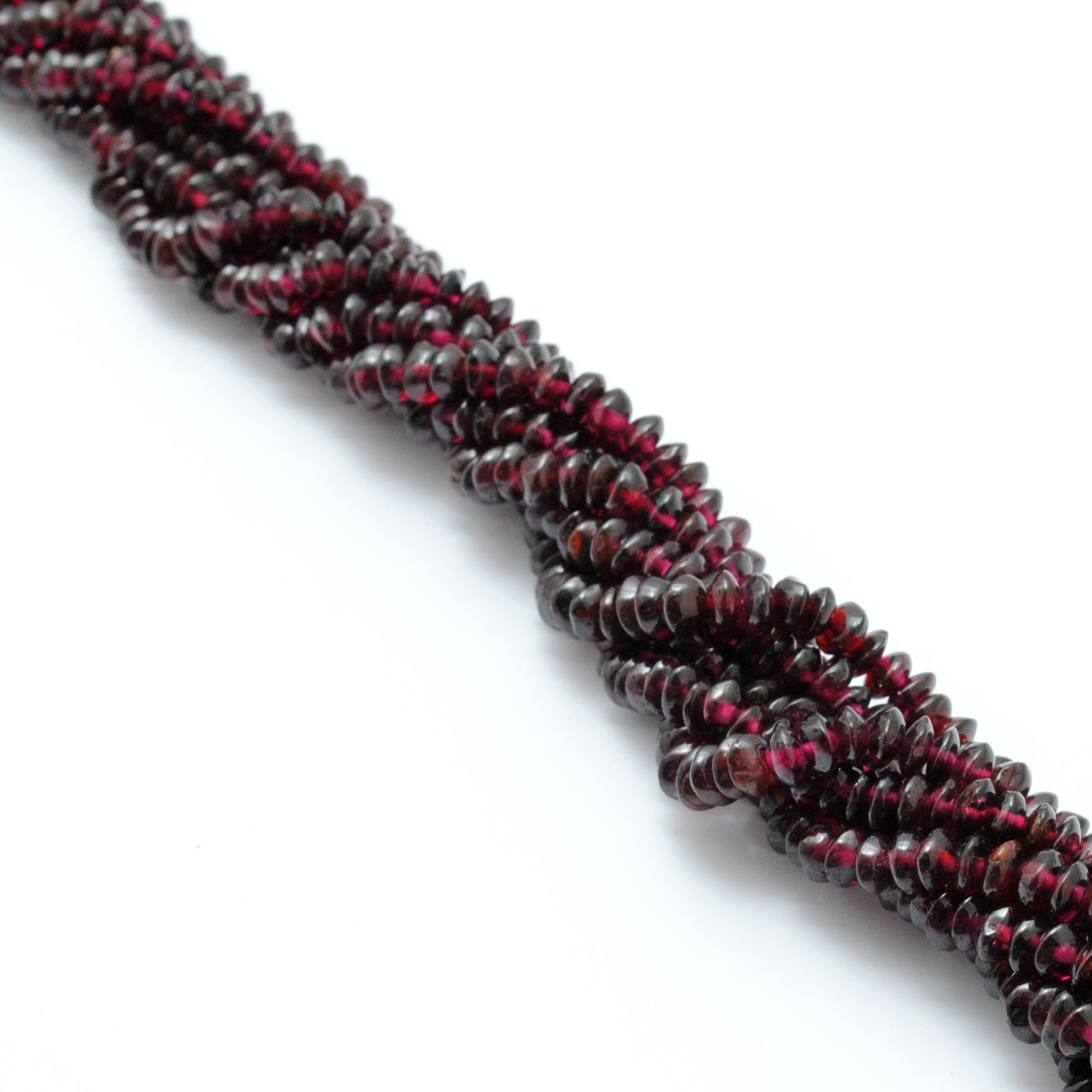 Rhodolite garnet 4-5mm button beads texture close-up