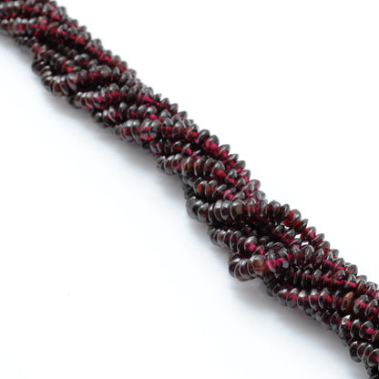 Rhodolite garnet 4-5mm button beads texture close-up