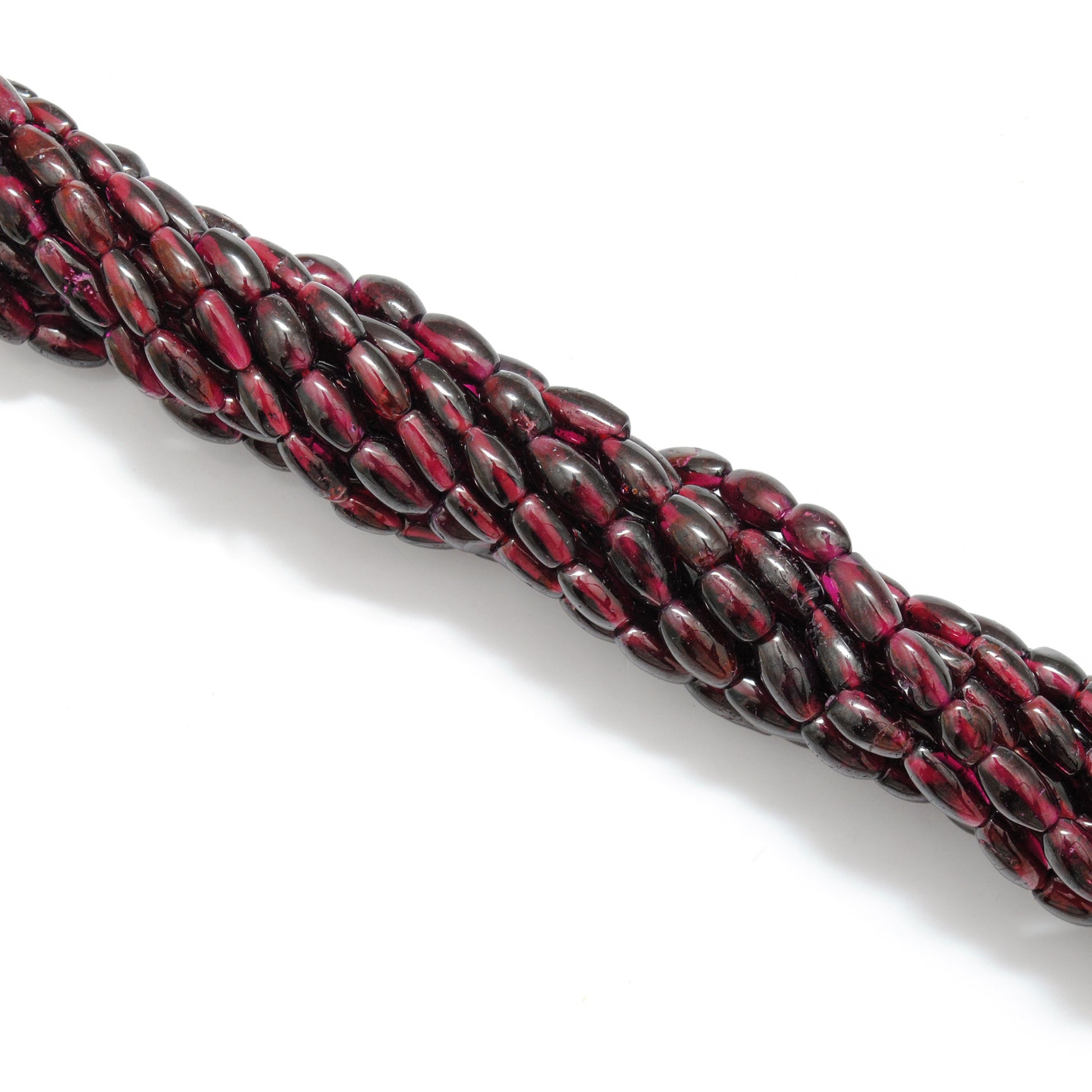 Rhodolite garnet drum beads 16 inch strand - overhead flat lay
