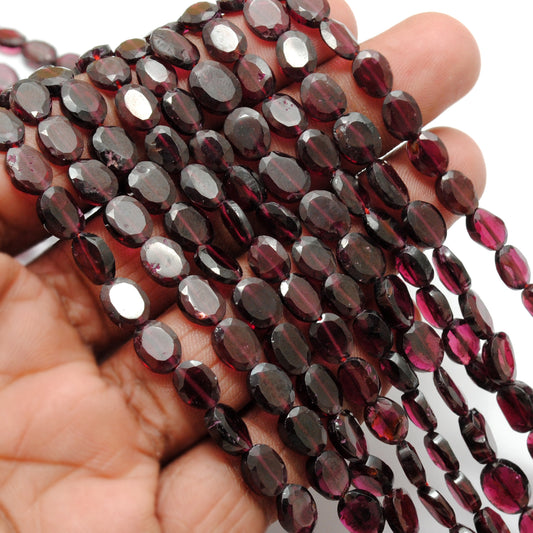 Natural rhodolite garnet faceted oval beads 5x7-6x8mm 17 inch strand - front view
