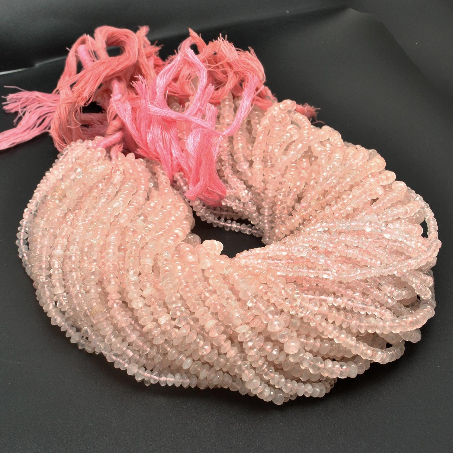 Rose quartz plain button beads 14 inch strand overhead flat lay