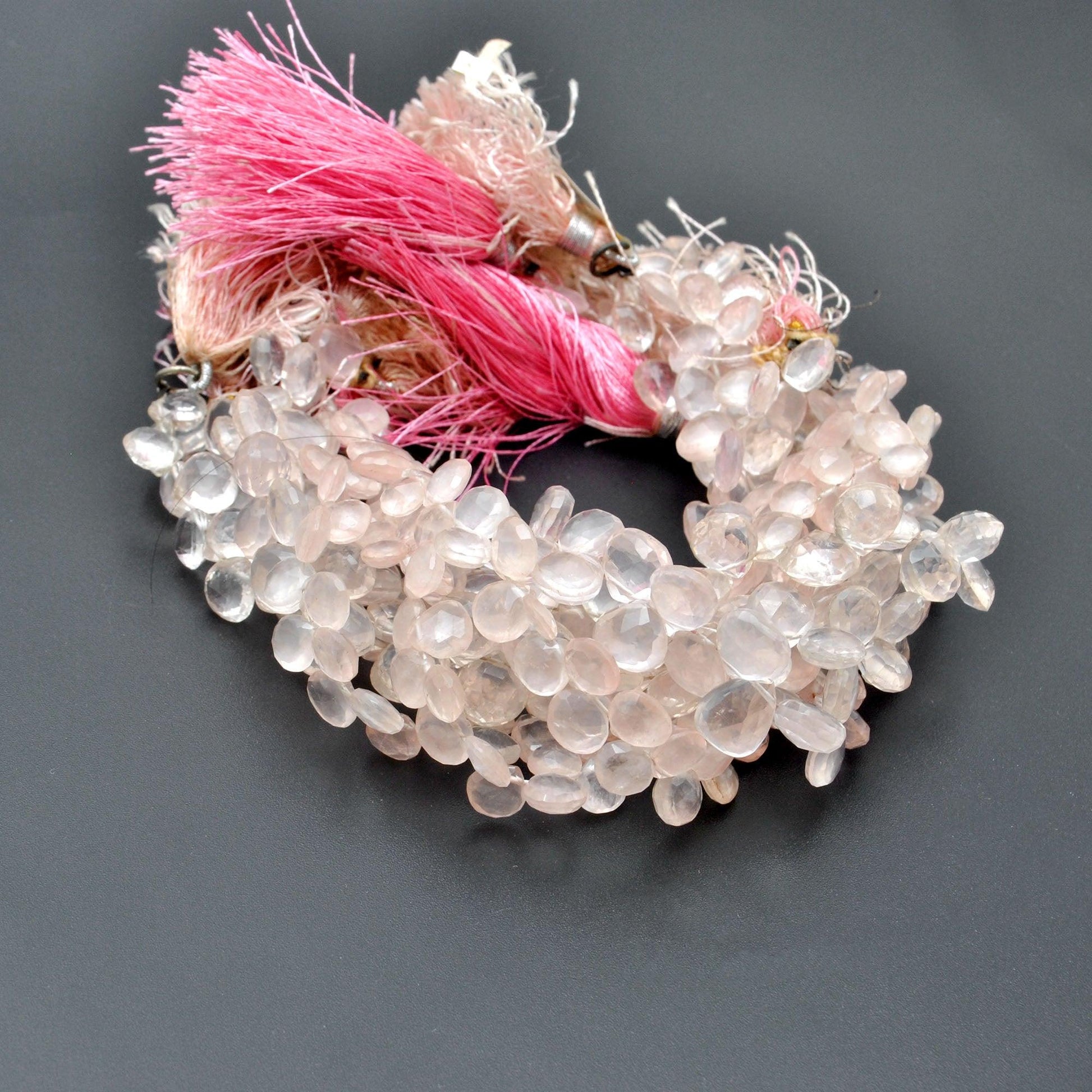 Rose quartz faceted heart beads 10 inch strand overhead flat lay