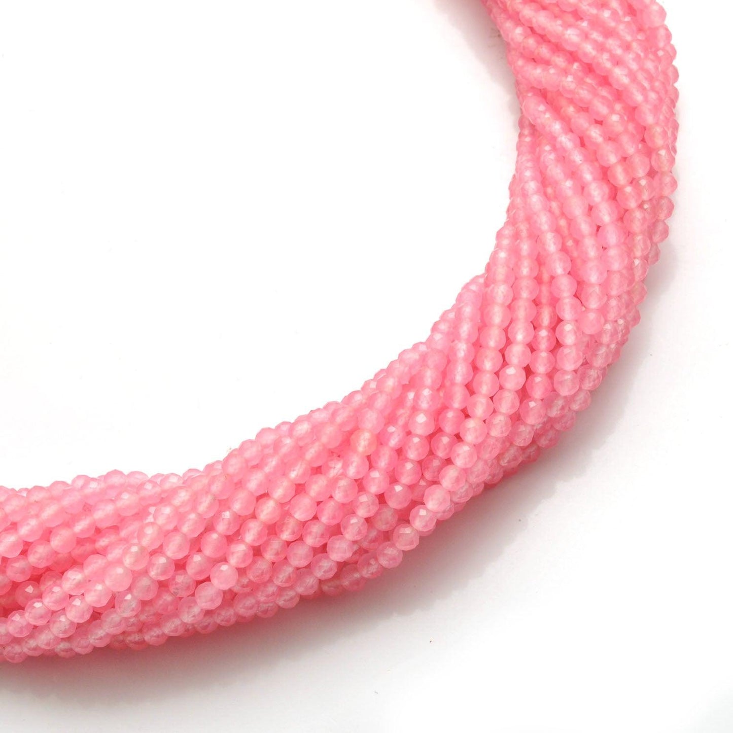 Rose quartz round faceted beads 13.5 inch strand overhead flat lay