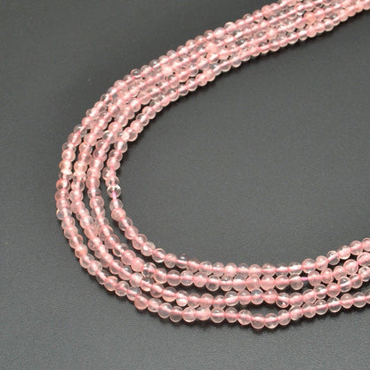 Rose quartz plain round gemstone beads full strand view