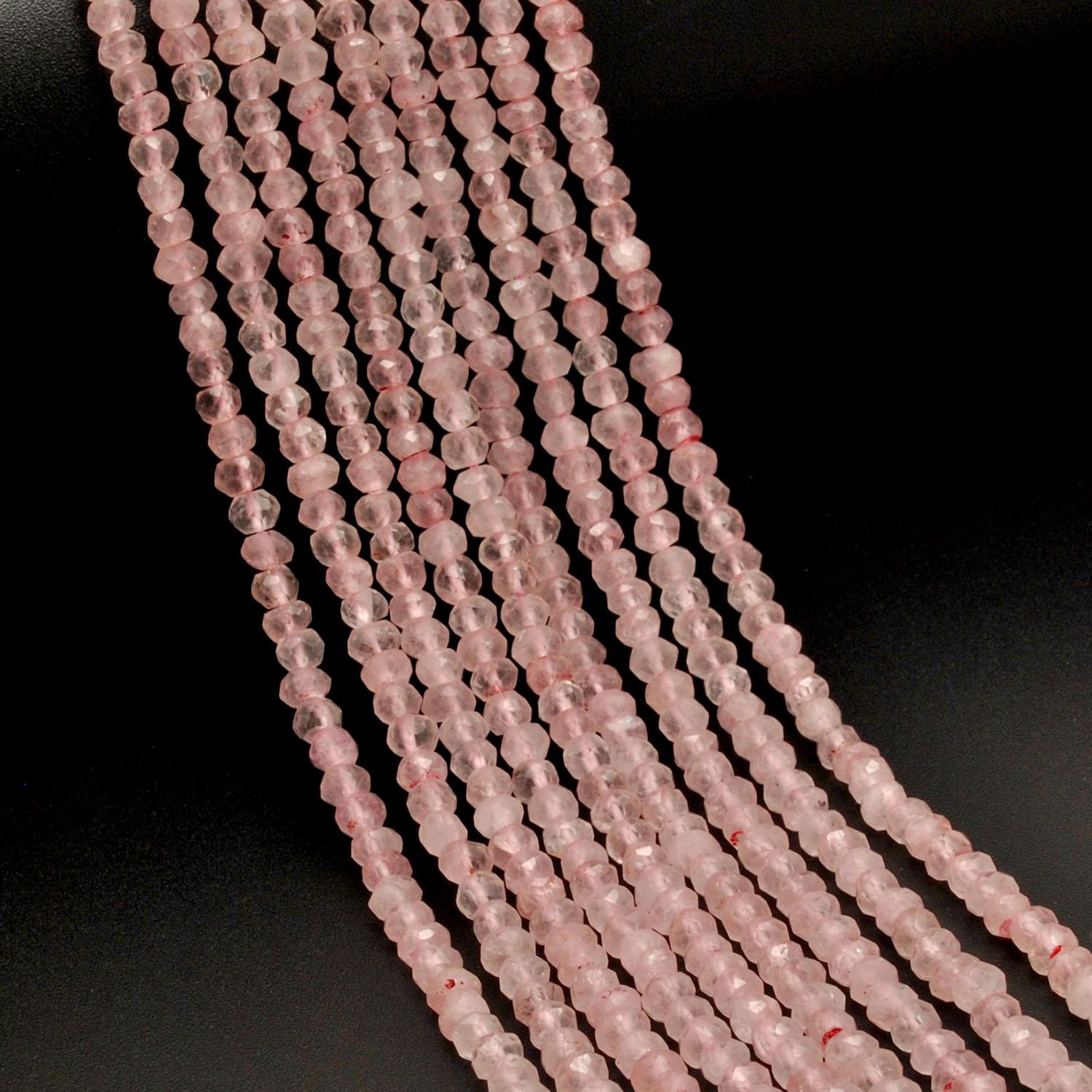 Rose quartz faceted rondelle beads 13 inch strand overhead flat lay