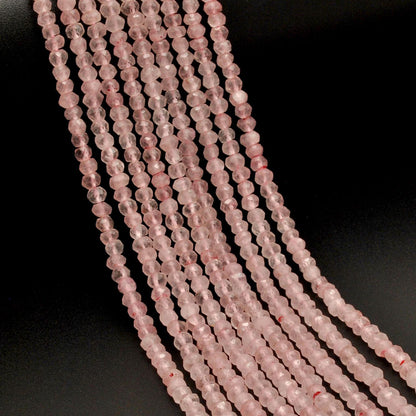 Rose quartz faceted rondelle beads 13 inch strand overhead flat lay