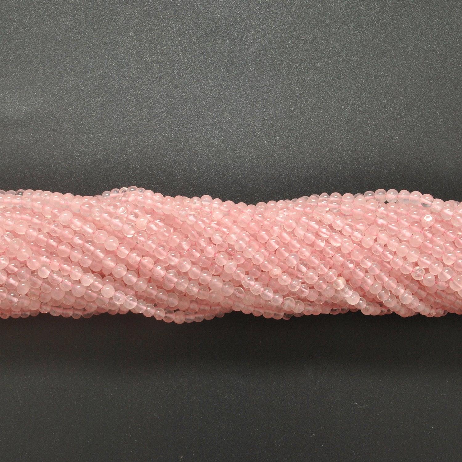 Rose quartz plain round beads knotted strand display