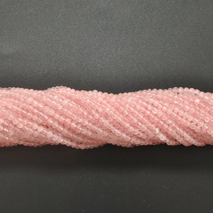 Rose quartz plain round beads knotted strand display