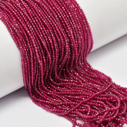 Ruby corundum round beads 13 inch strand overhead flat lay