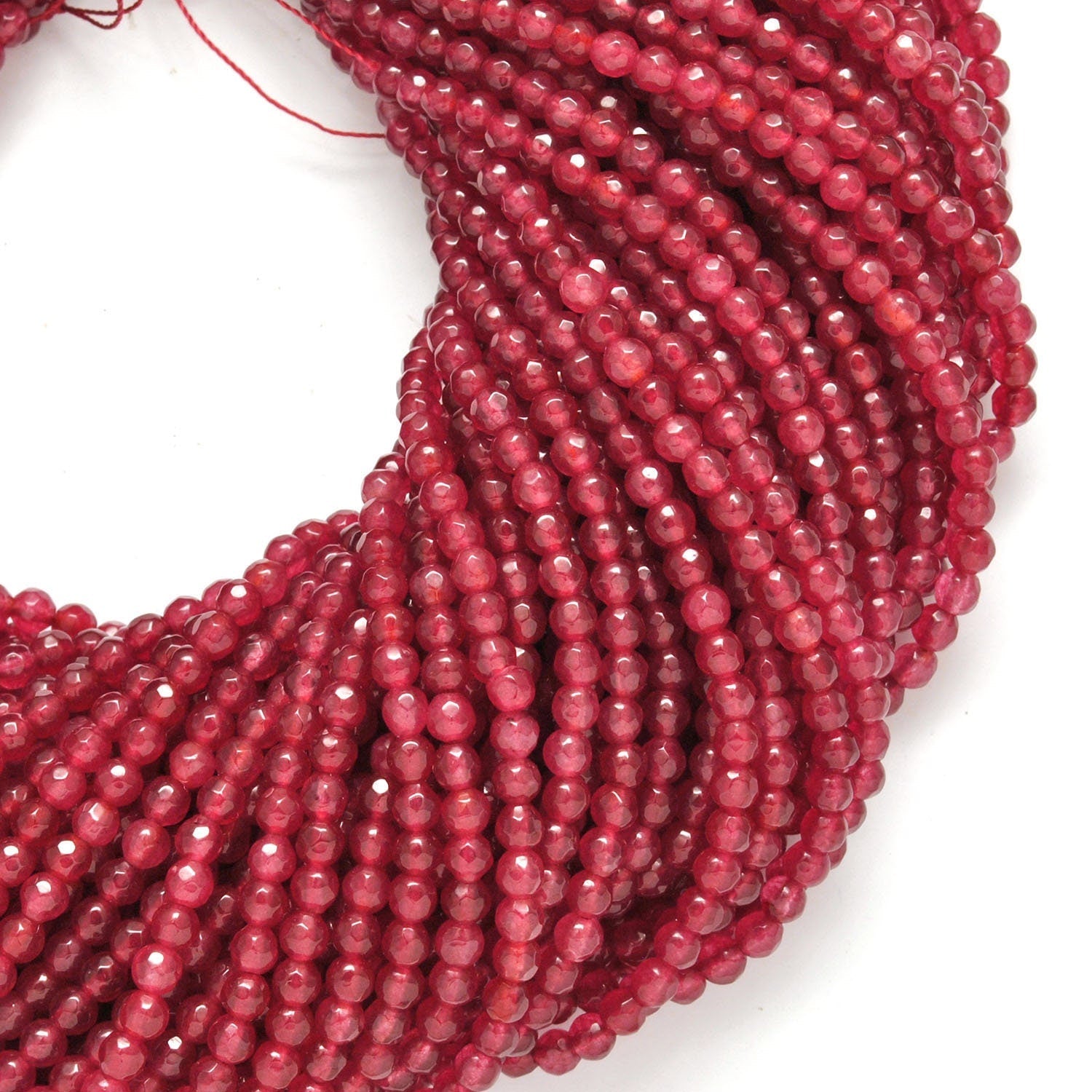 Red ruby quartz round beads 15 inch strand overhead flat lay