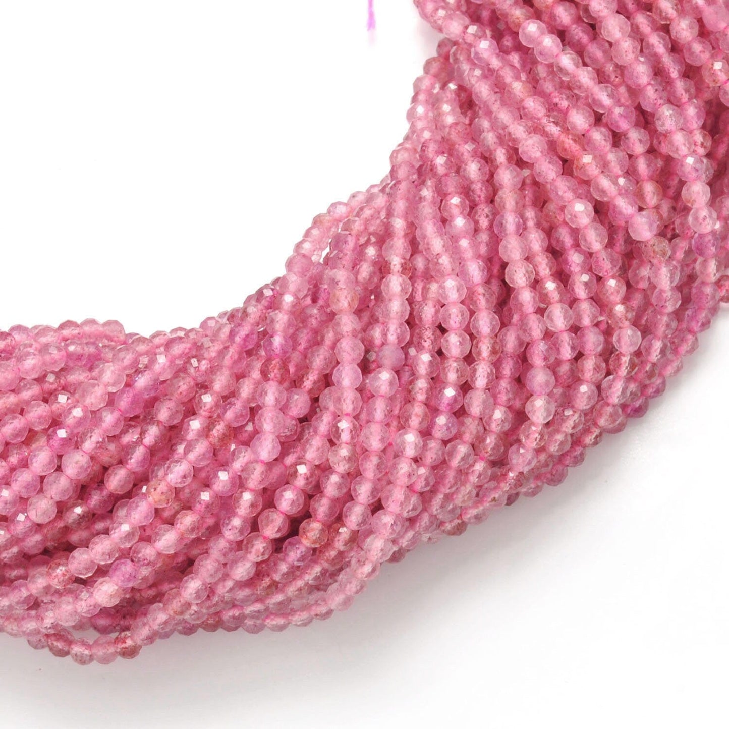 Strawberry quartz faceted round beads 15 inch strand overhead flat lay