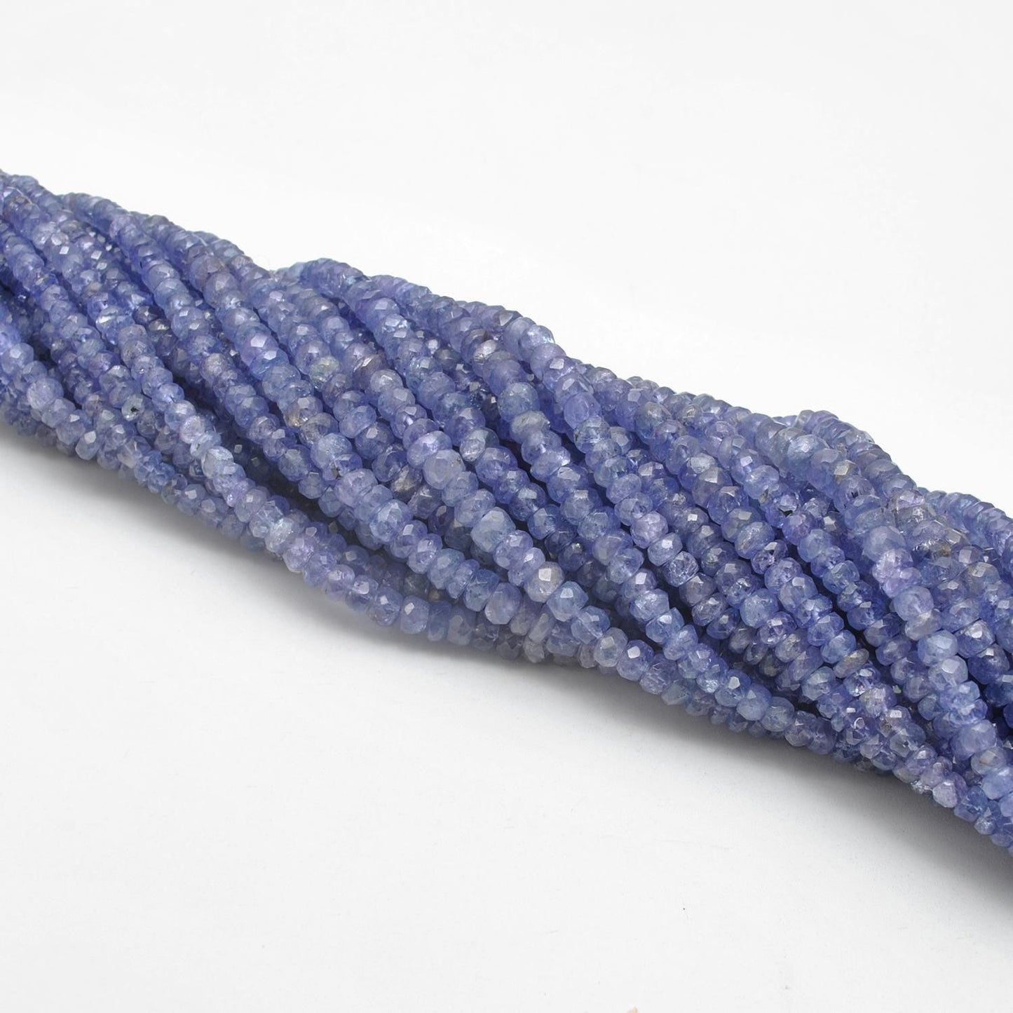 Tanzanite 4mm rondelle beads 16 inch strand overhead flat lay
