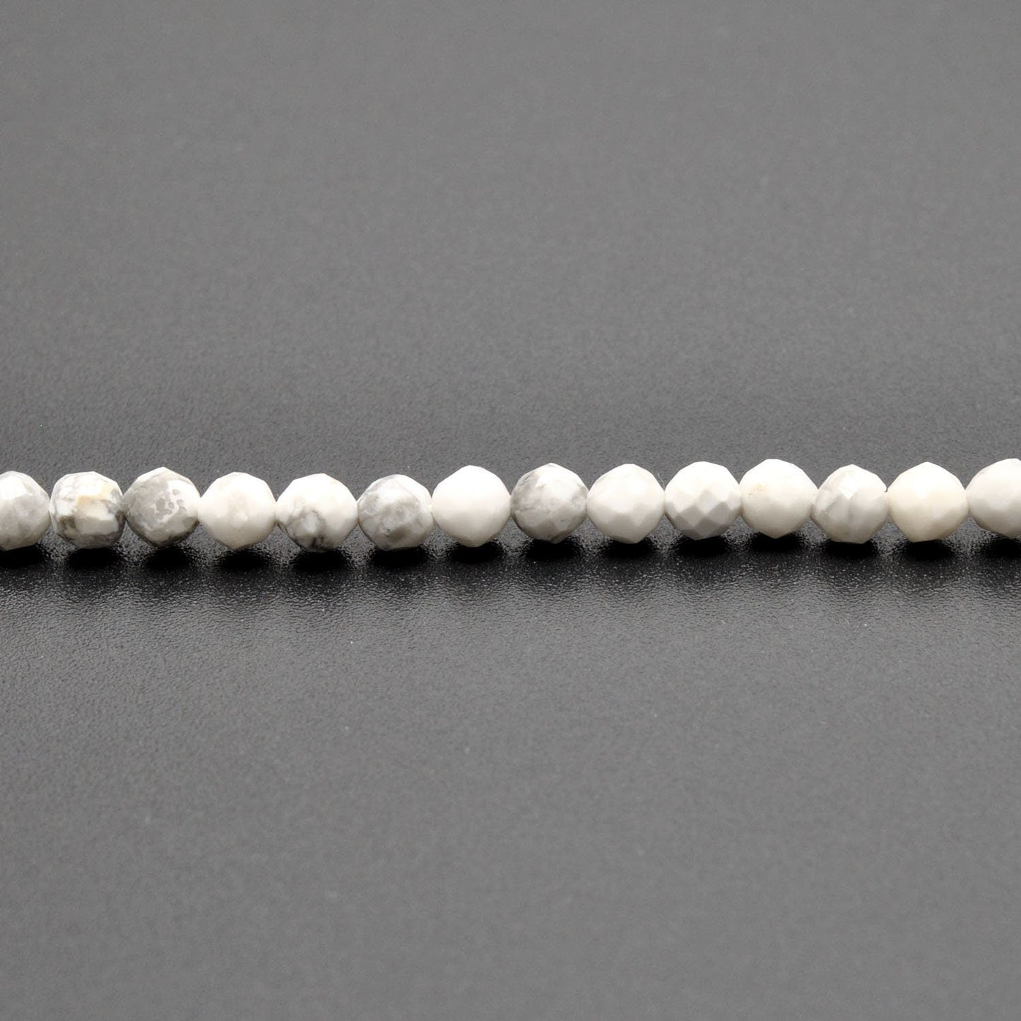 White howlite round beads 12.5 inch strand overhead flat lay