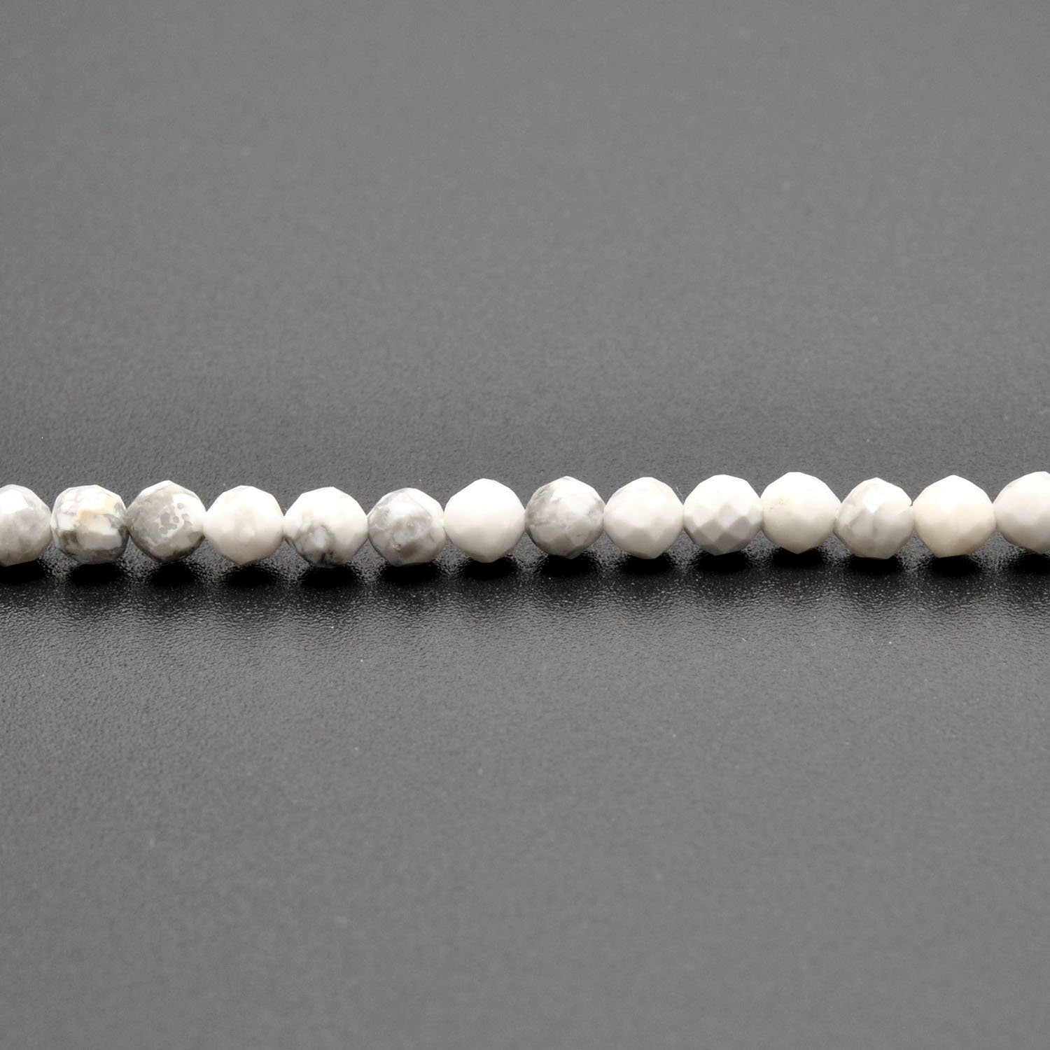 White howlite round beads 12.5 inch strand overhead flat lay